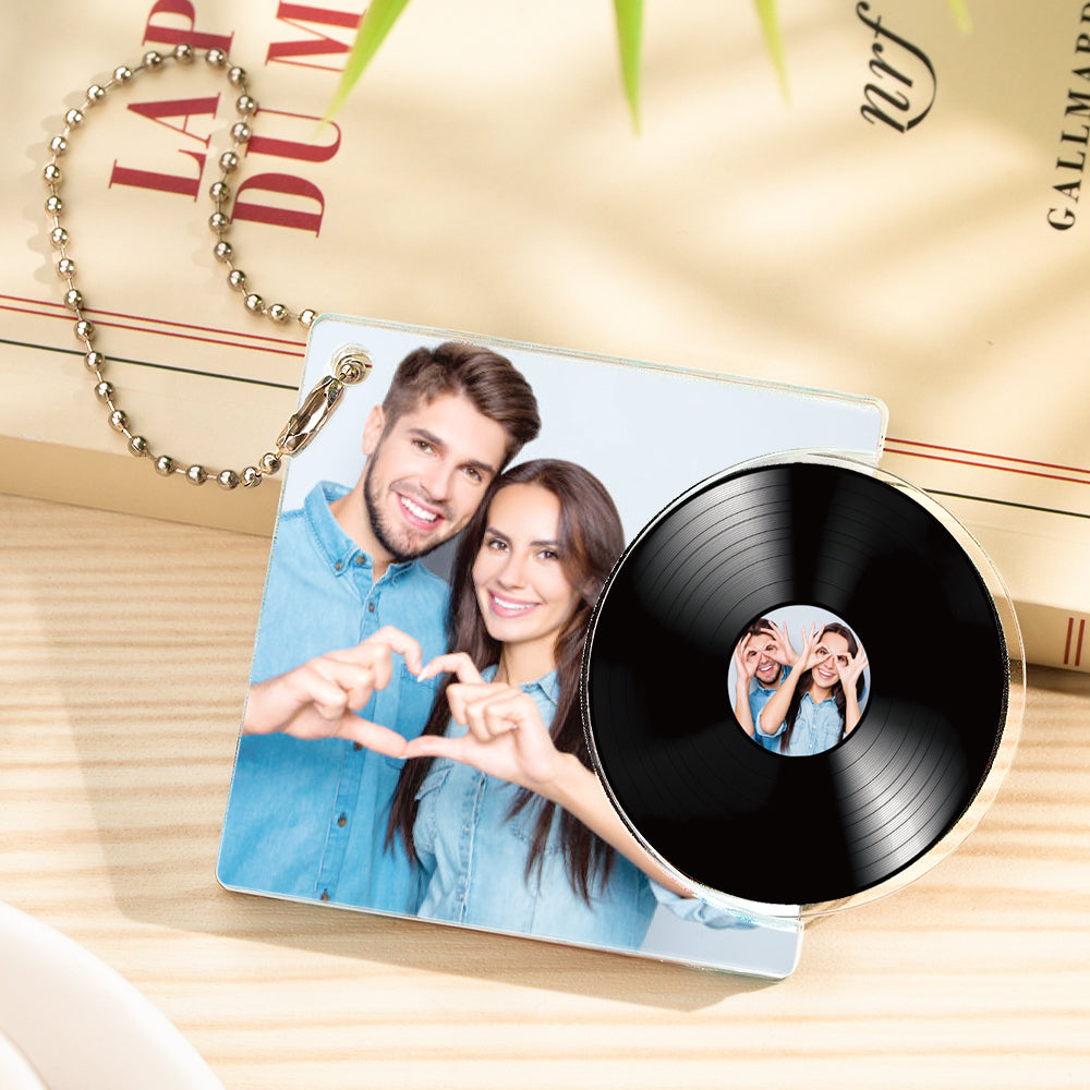 Close-up of personalised acrylic vinyl record keyring with photo and custom text, NFC-enabled keychain ideal as a romantic gift