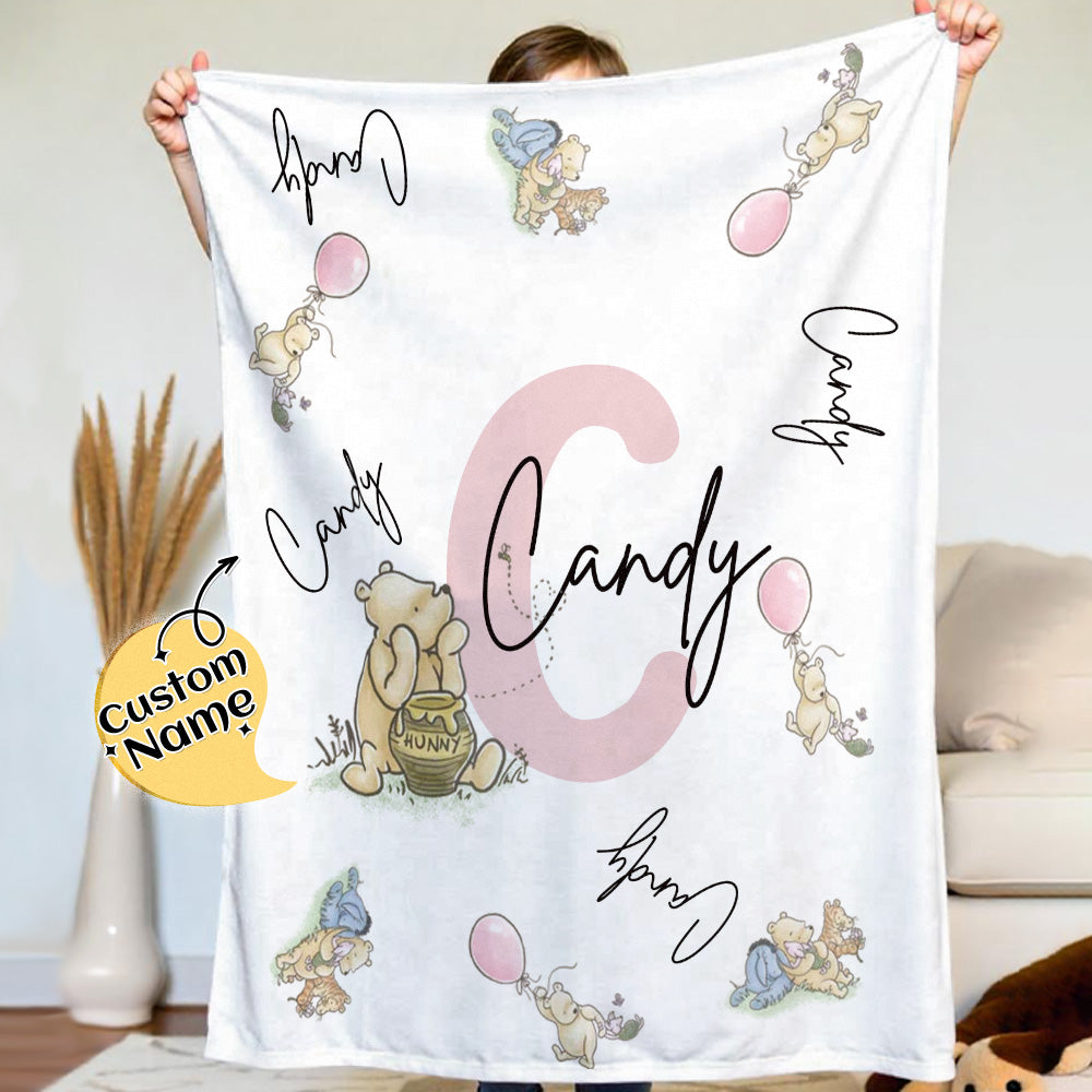 Personalised Winnie the Pooh name blanket in soft flannel, a cosy nursery throw customised with a child's name.