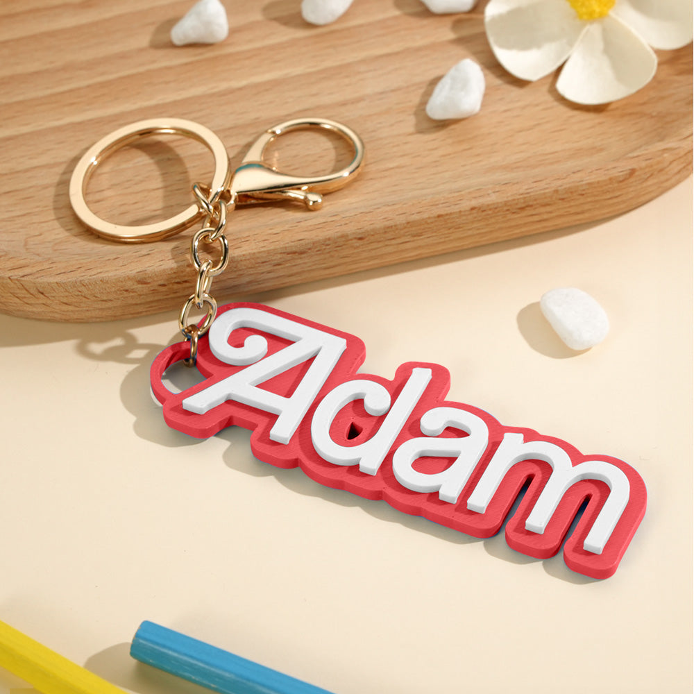Personalised bag charm displayed against a neutral background highlighting vibrant colours and engraved text kids' bag charm