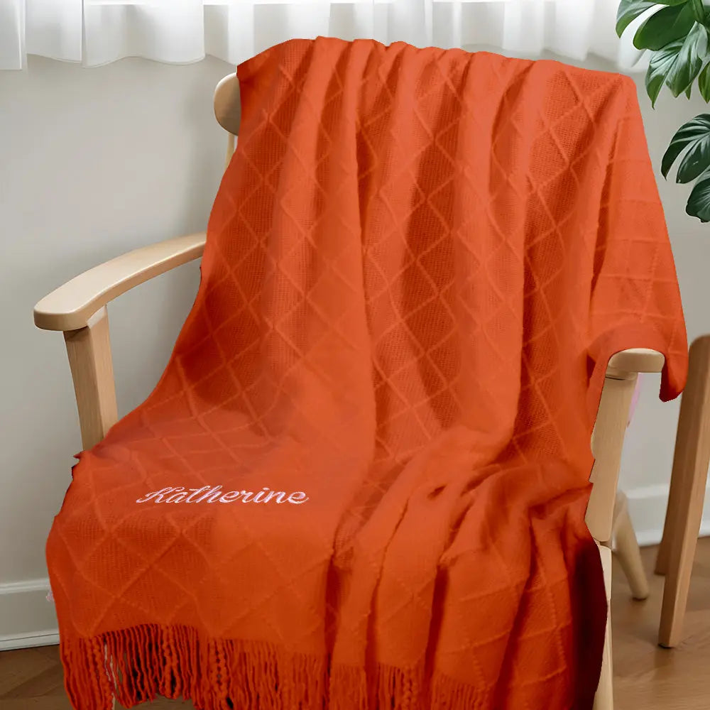 Blanket draped over a chair to show natural drape and size suitable for kids.