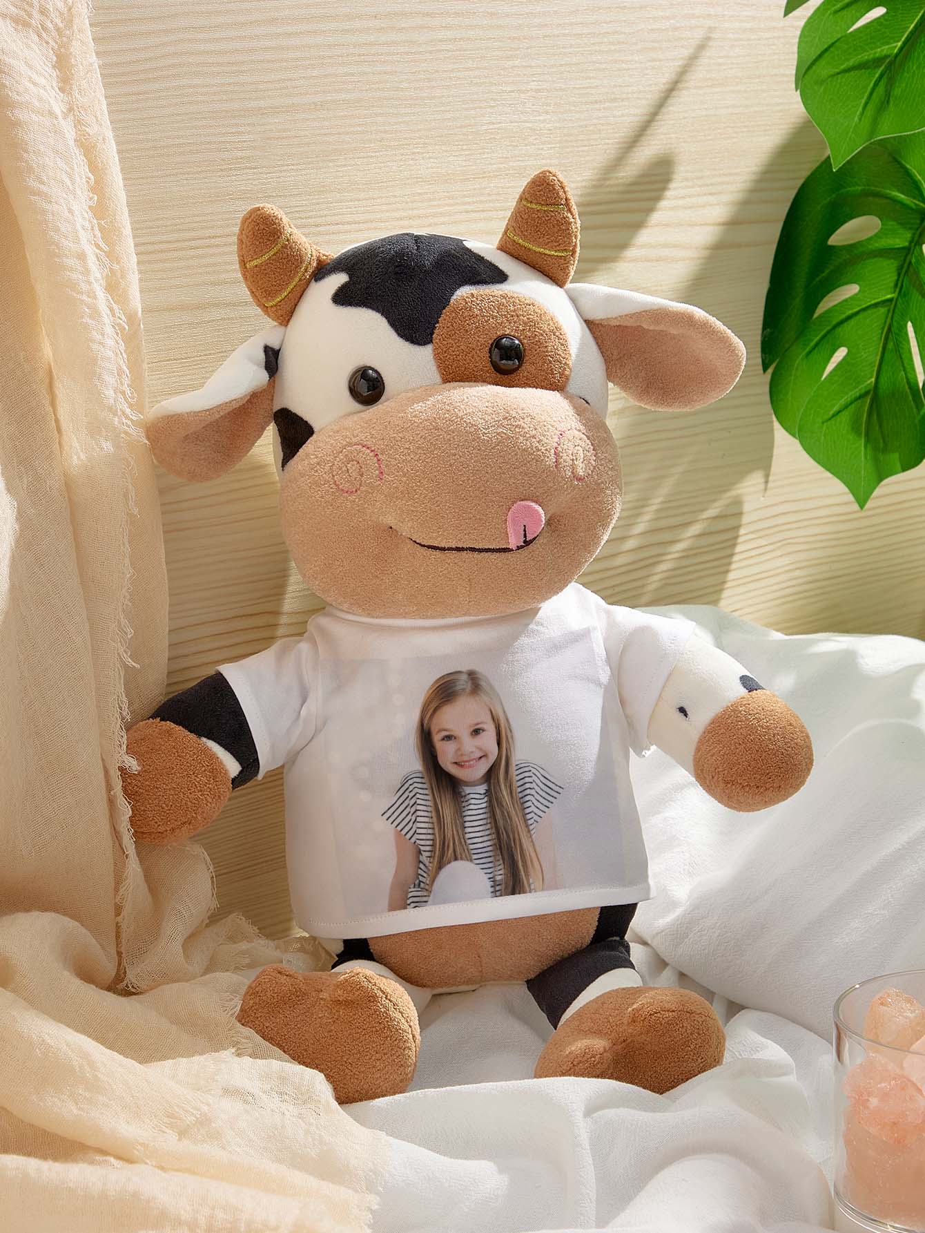Close-up of personalised cow plush showing custom printed photo and soft plush fabric detail — high‑resolution keepsake