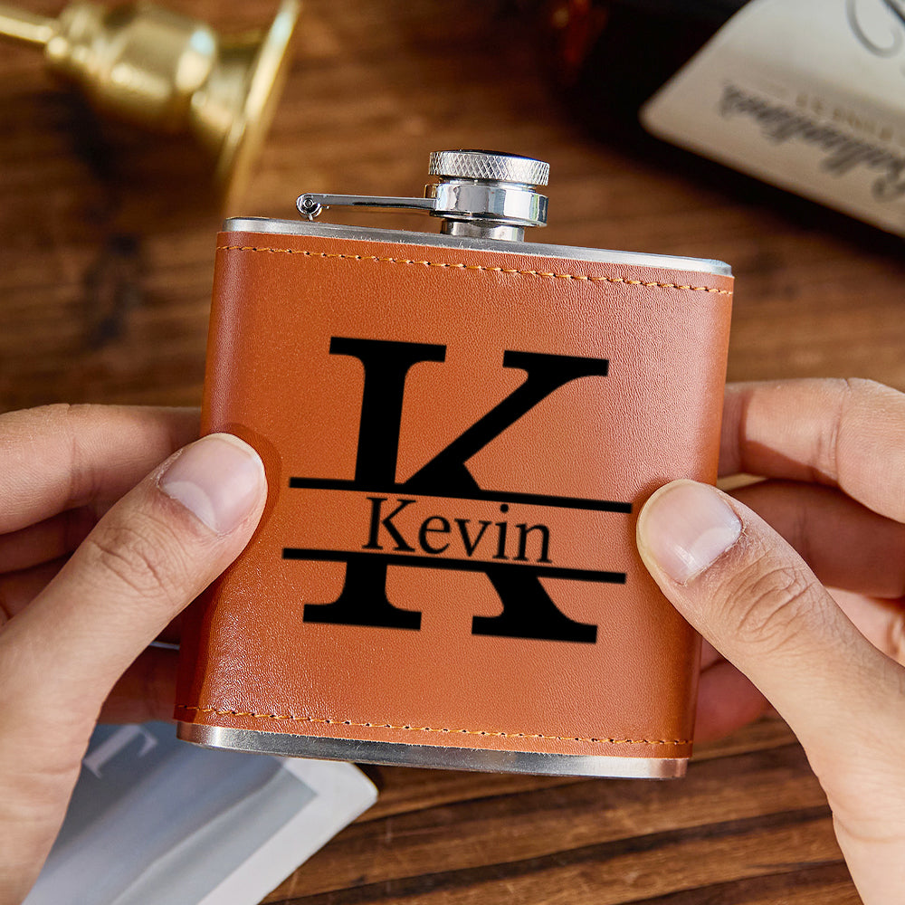 Close-up of precision engraving and textured stitching on the PU leather wrap of a 6oz stainless steel personalised whisky flask