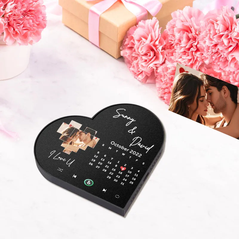 FridgeBeats heart-frame album magnet attached to a refrigerator showing the charging port and control buttons — rechargeable personalised singing fridge magnet ideal for Valentine’s or anniversaries