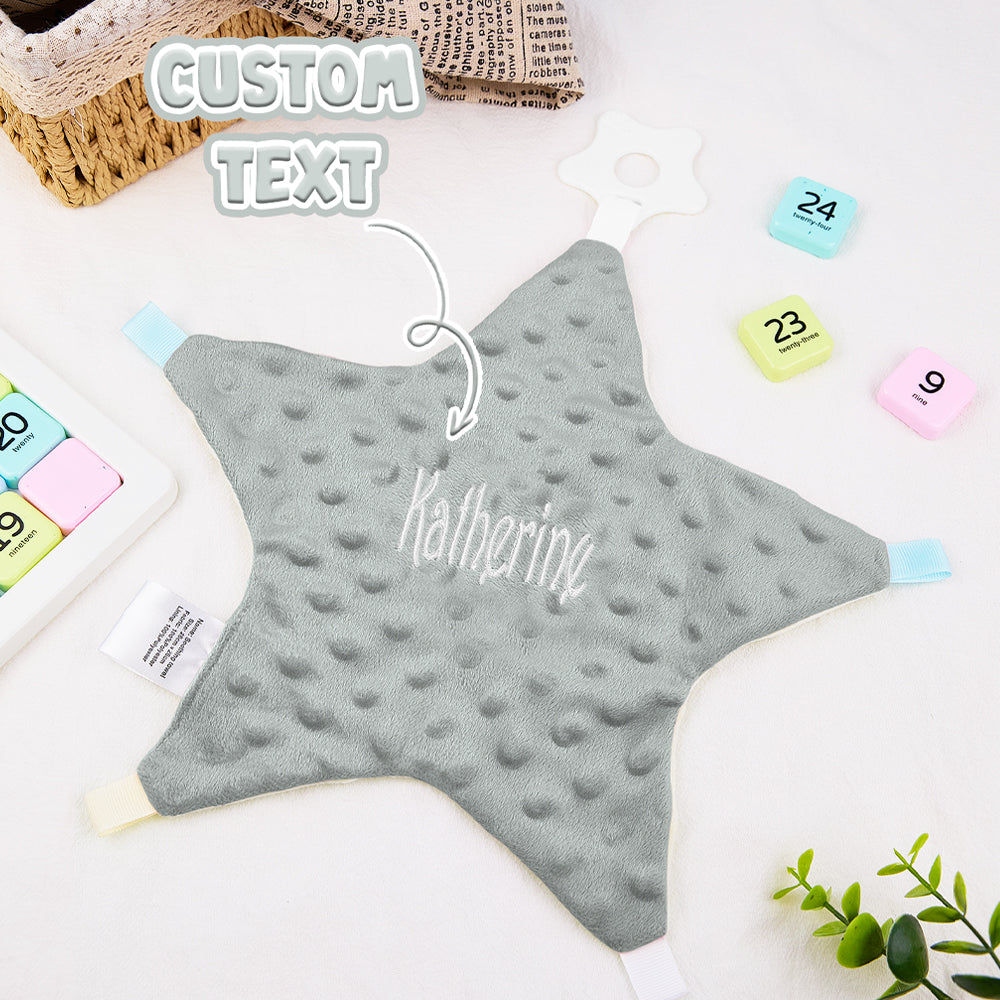 Hand-sized view of the 26cm personalised baby comforter, easy for little hands to hold with embroidered name on soft cotton star