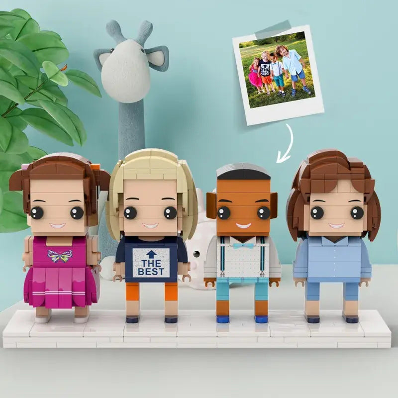 Group view of 4‑person customisable small‑particle block figures with simple accessories and varied outfits — personalised ABS block keepsake for family