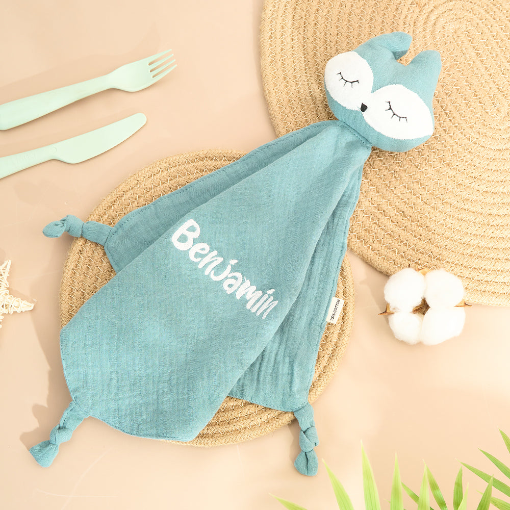 Close-up of embroidered name on personalised baby comfort towel showing neat stitching and soft cotton texture — ideal baby shower gift