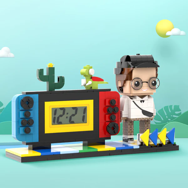 Angled view of a personalised handheld game console clock with block-style minifigure and clear clock face — unique personalised photo gift for him or her
