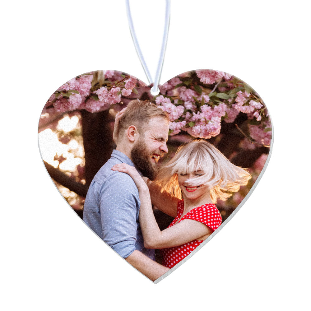 Heart-shaped personalised air freshener hanging in a car interior, showcasing its use as a charming interior ornament.