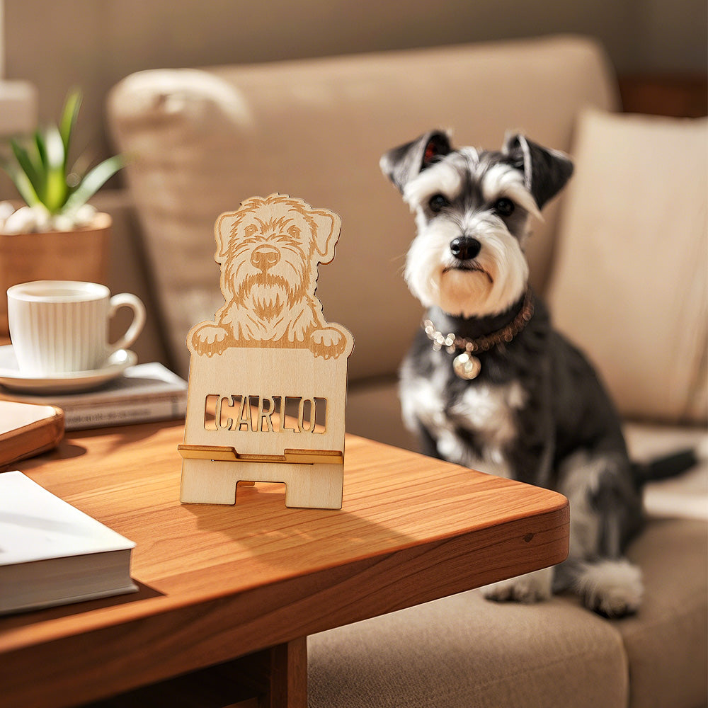 Close-up of engraved pet portrait on wooden phone stand