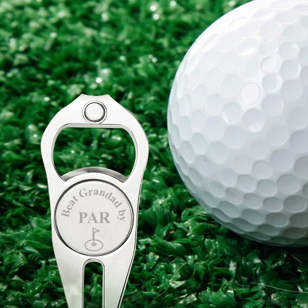 Close‑up of laser‑engraved personalised text on zinc alloy golf ball marker with visible fork and bottle opener details — high quality finish