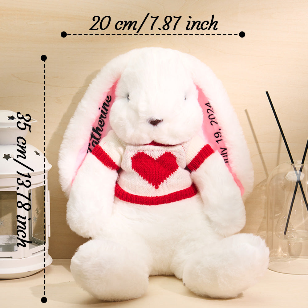 Detail of jumper stitching and embroidered lettering on personalised rabbit teddy – thoughtful personalised name gift