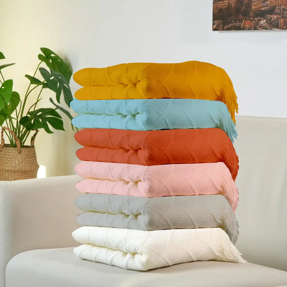 Decorative tassels along the edge of the personalised kids blanket.