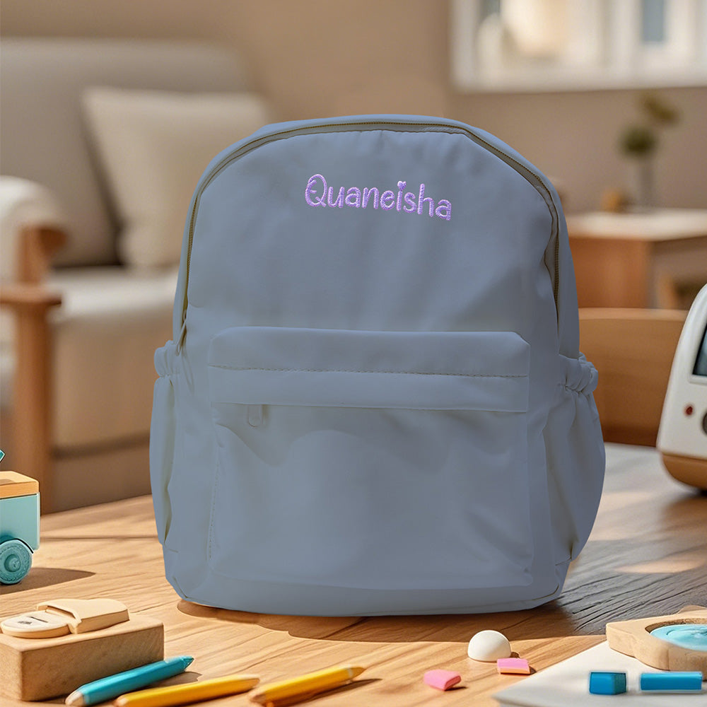 Detail shot of secure zip closure and reinforced stitching on a custom embroidered kids school bag