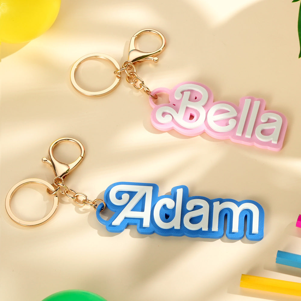 Close up of engraved personalised name on PLA bag charm showing clear custom text personalised name gifts for children