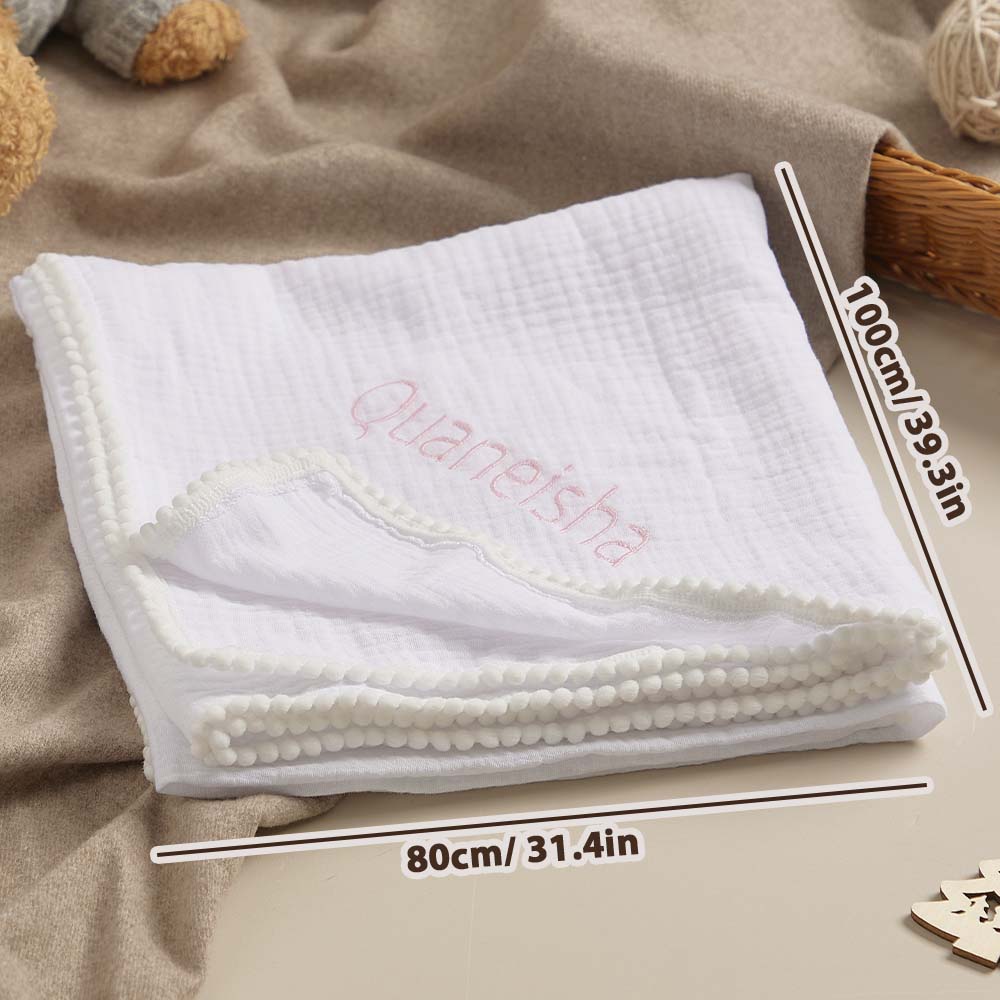 Close-up of the airy, breathable weave of the 100% cotton muslin swaddle.