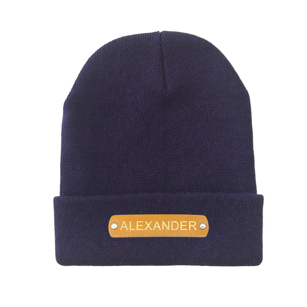 Casual styling shot of personalised leather patch beanie paired with a winter coat, versatile custom name hat for everyday wear
