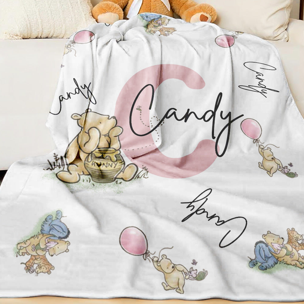 Close-up of customised name printing on the Winnie the Pooh blanket.