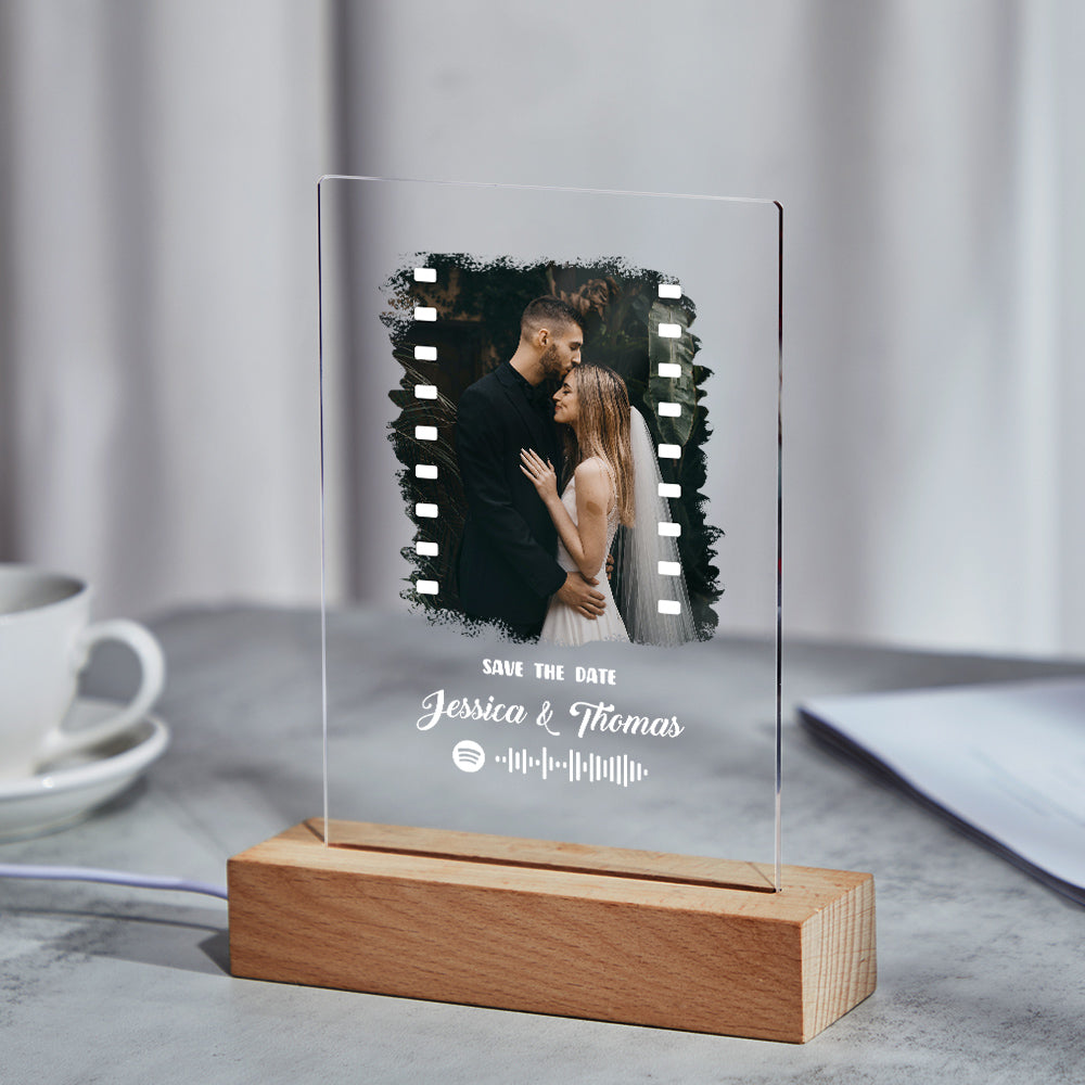 Angled view of the personalised Spotify Music Photo Plaque and keychain set in clear acrylic, highlighting the engraved code and photo.