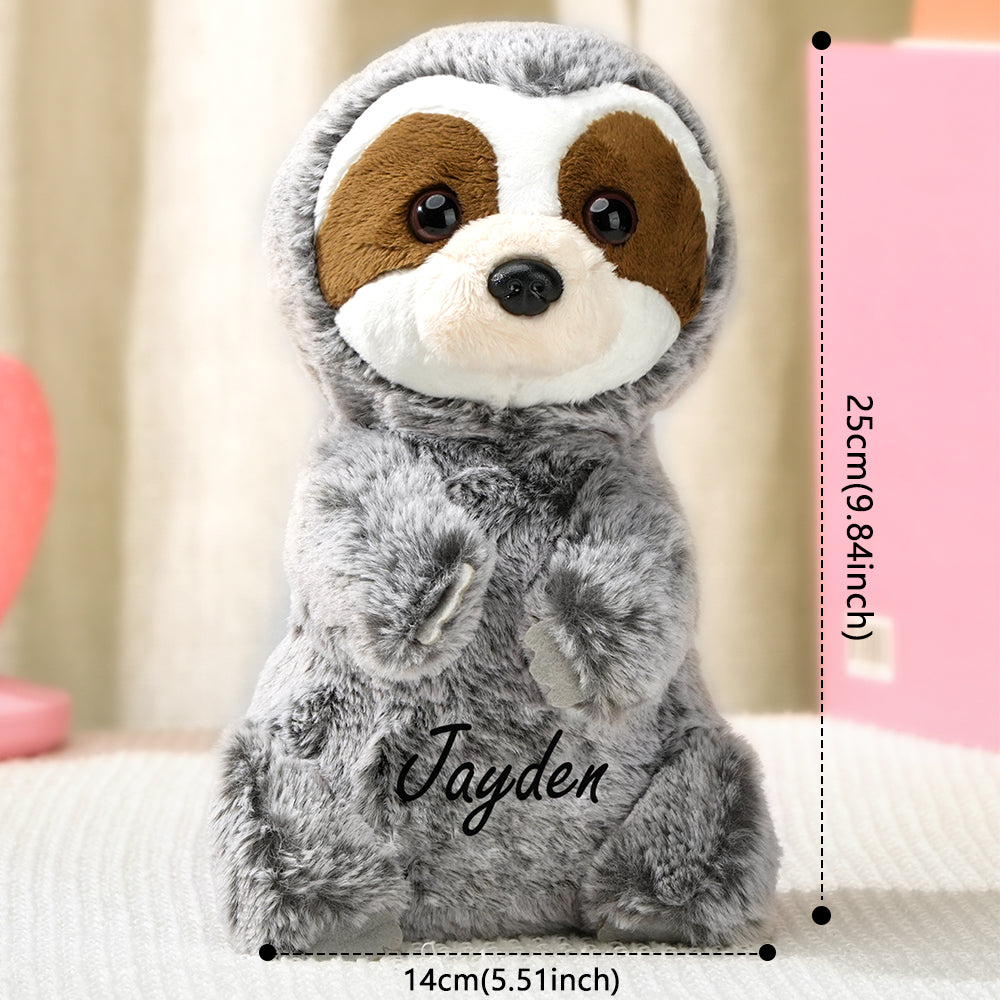 Size comparison of personalised sloth plush beside ruler showing 14×25 cm compact personalised baby gift