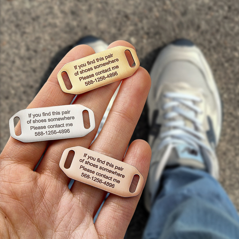 Personalised shoe tag attached to trainer laces — stainless steel engraved ID for running shoes and trainers