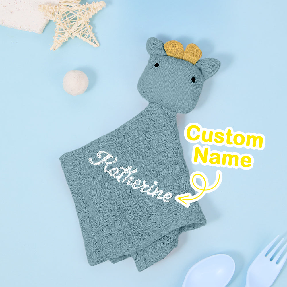 Close up of embroidered name on personalised cotton comforter, soft texture of custom baby lovey