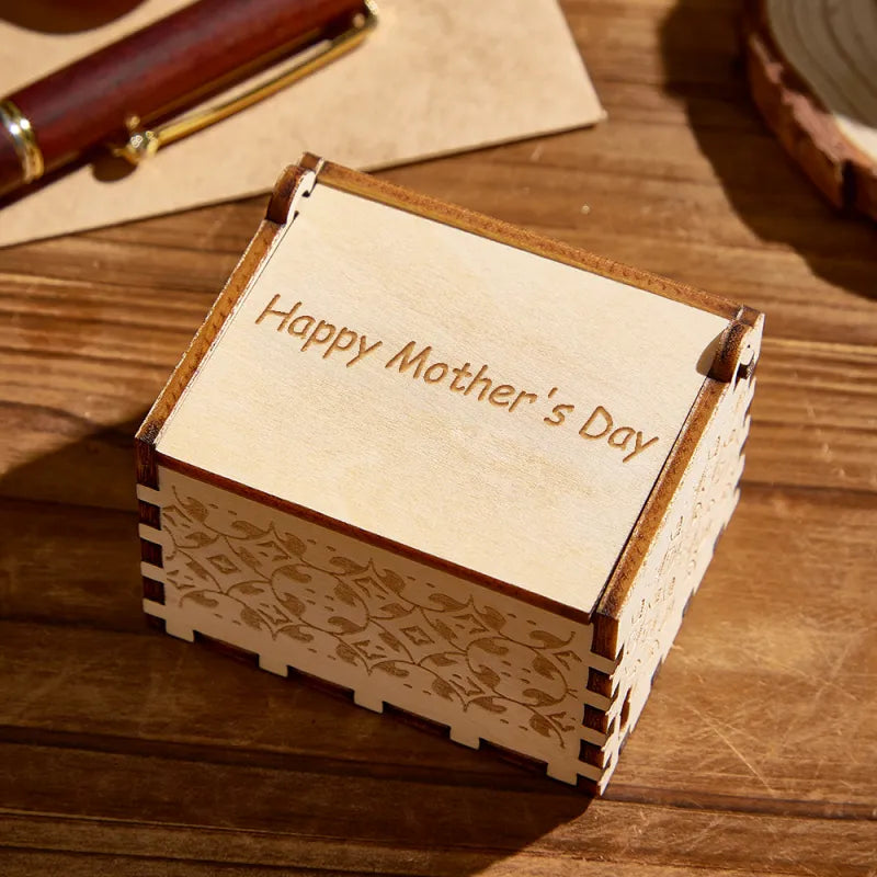 Close-up of engraved custom text on wooden lid of personalised photo music box — elegant bespoke engraving for names, dates or short quotes