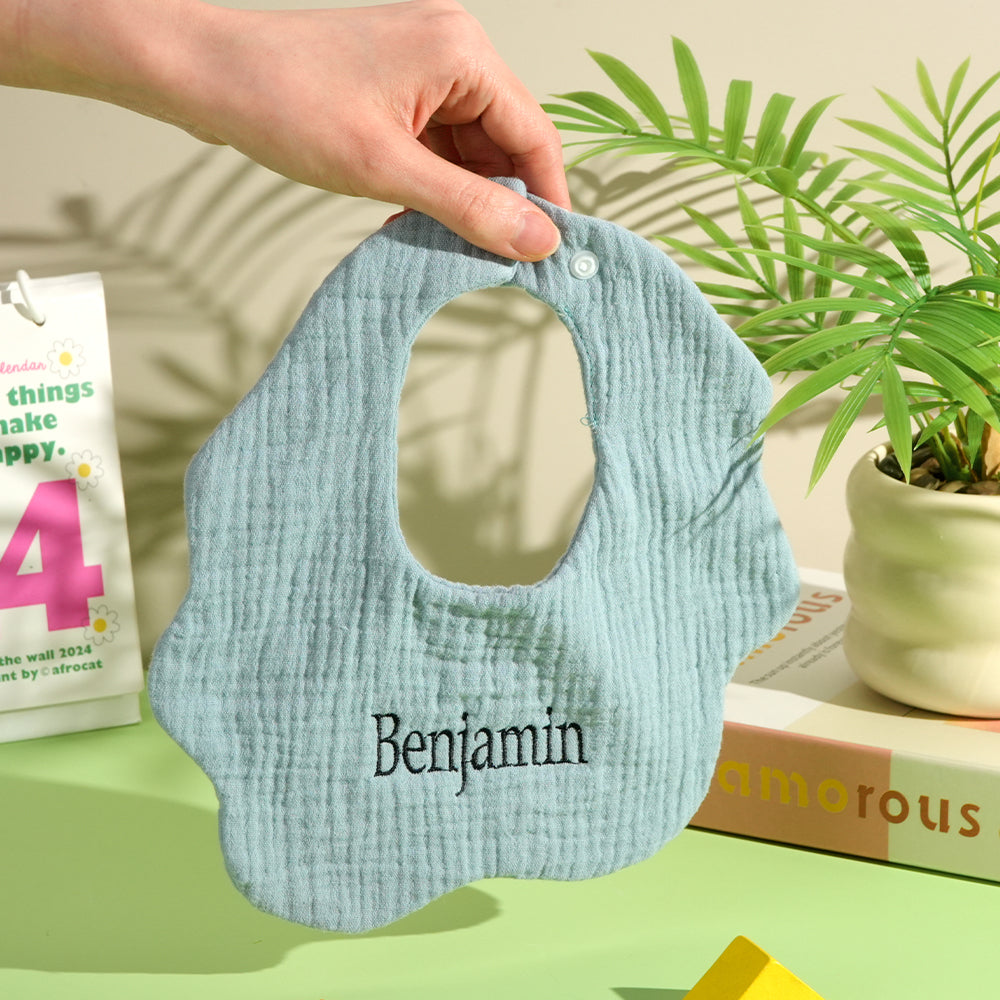 Back view of personalised embroidered bib showing secure popper fastening and soft neckline — easy-to-use newborn bib