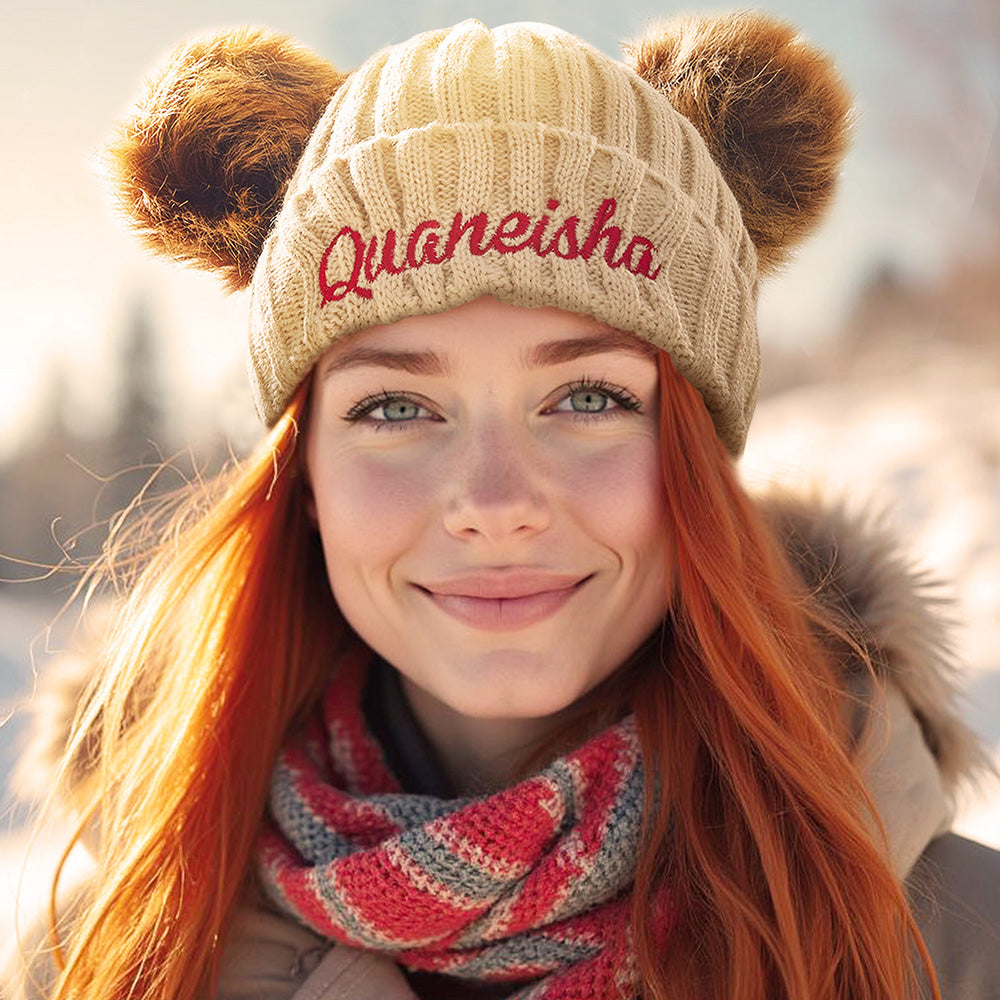 Close‑up of baby personalised beanie hat showing embroidered name detail on soft Orlon knit — bespoke baby gift idea