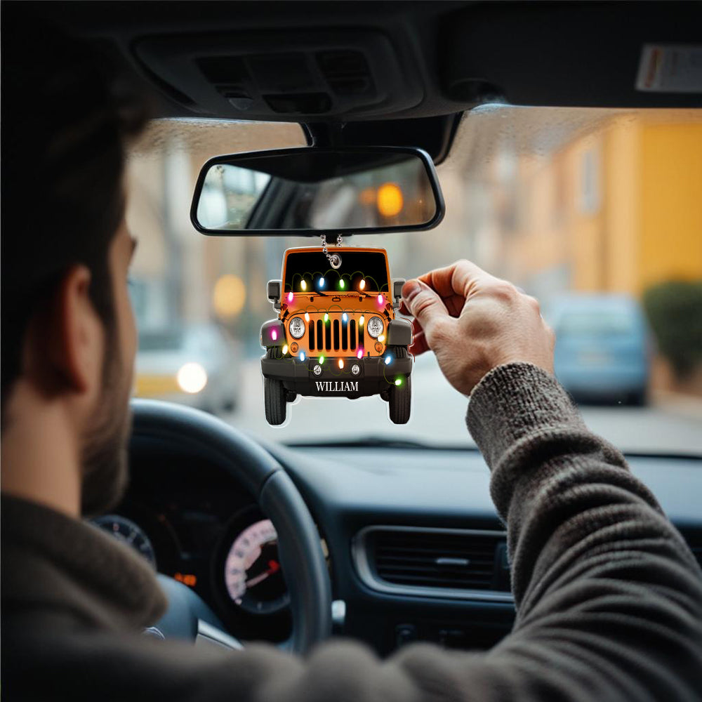 Personalised engraved car ornament displayed against seasonal décor, showcasing the crisp acrylic finish and custom name engraving