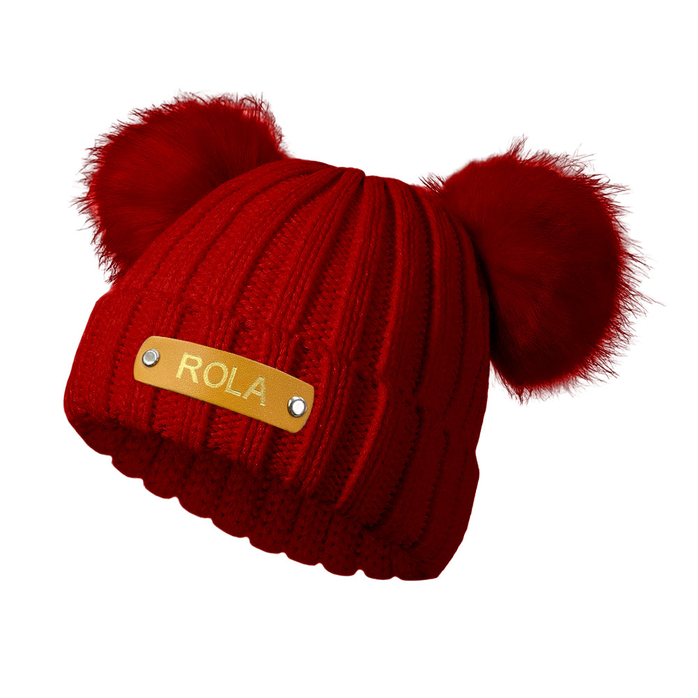 Toddler wearing a personalised baby beanie with custom name patch – warm, practical kids hat for autumn and winter