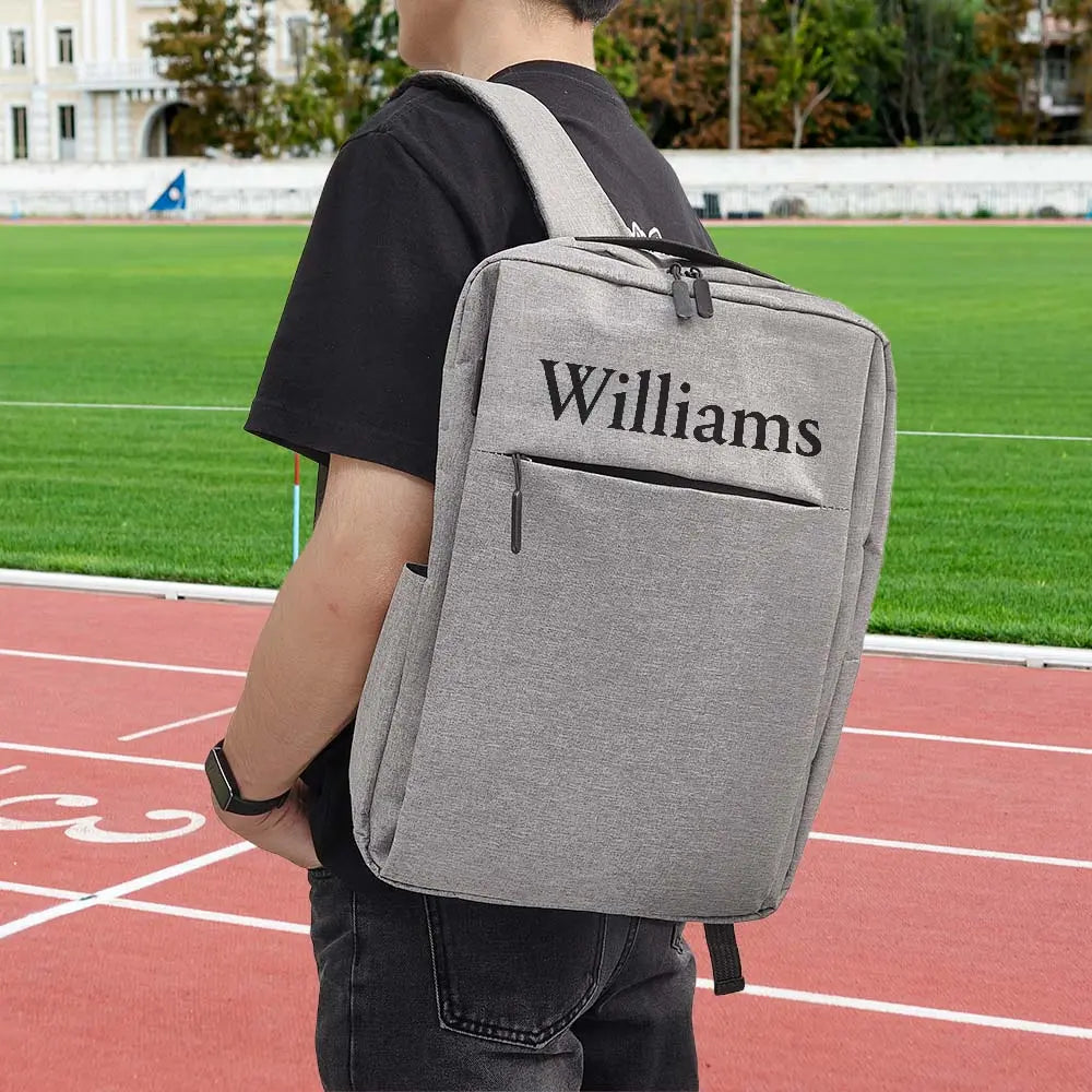 Personalised name backpack front view — custom 15.6-inch laptop backpack in durable polyester, ideal personalised college bag for men and women