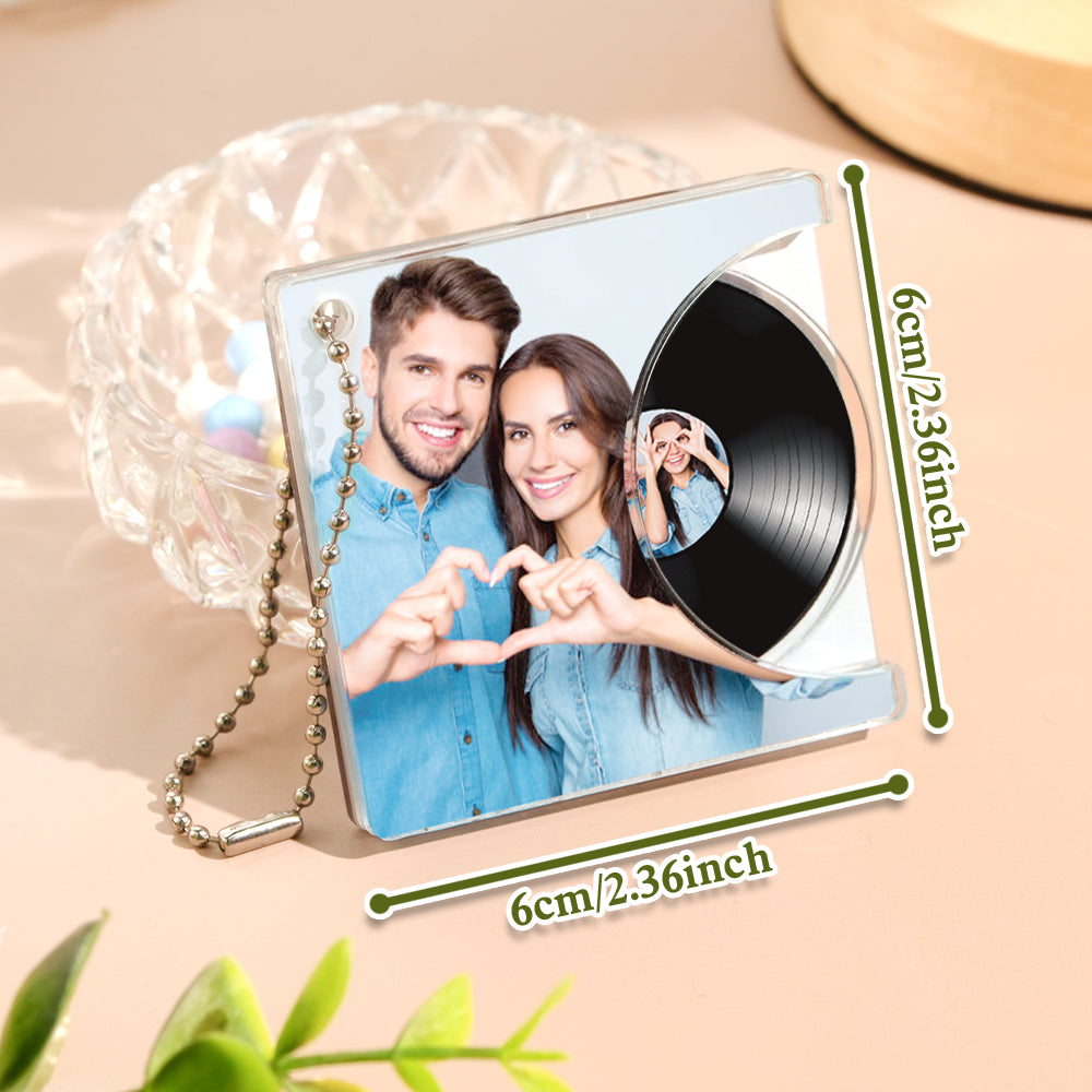 Demonstration of NFC tap-to-play vinyl keyring being tapped with an NFC-enabled smartphone to instantly play a personalised song