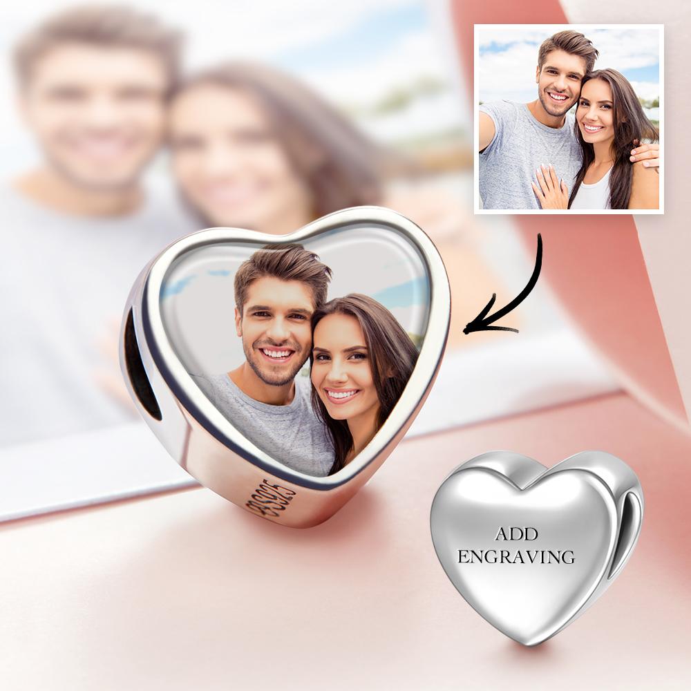 Close-up of personalised engraved heart photo charm with copper base and silver-plated oil-drip finish, double-sided clear photo — keepsake for bracelet or necklace