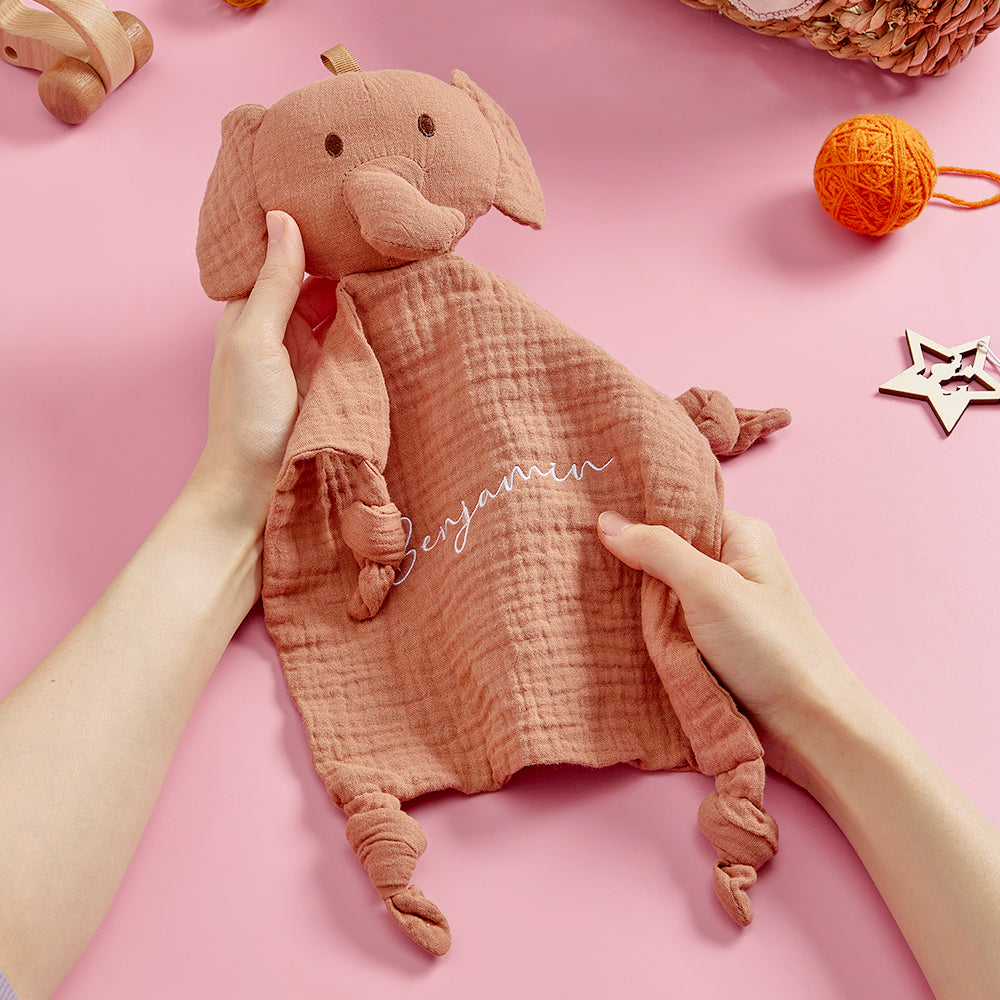 Close-up of the embroidered animal head on the towel.