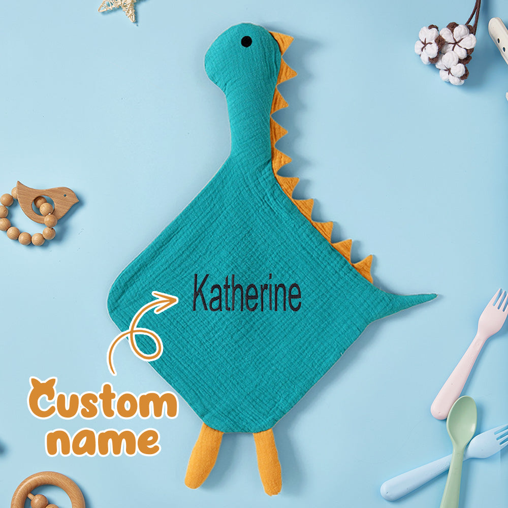 Folded personalised swan comforter showing neat embroidered name and compact size (38×54cm) — perfect personalised newborn gift