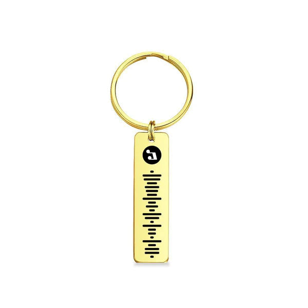 Hand holding a personalised projection music code metal keychain – compact custom song keyring keepsake