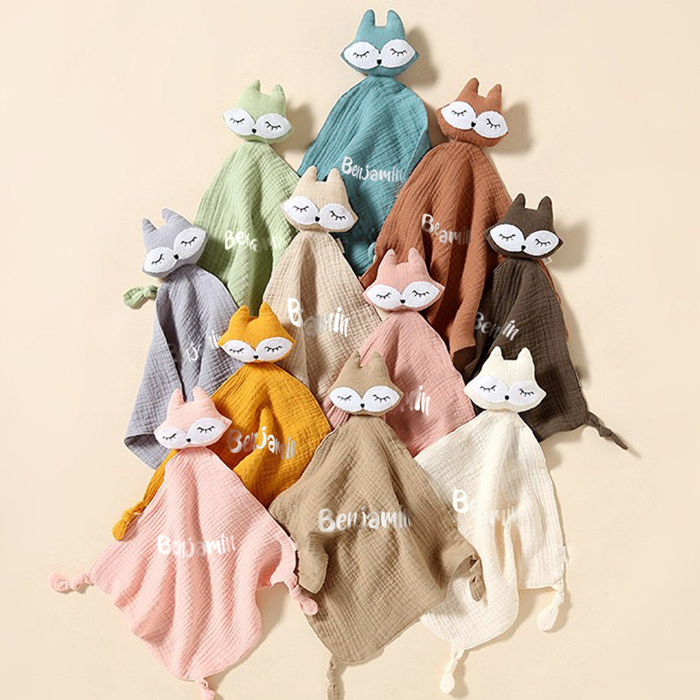 Gift presentation of a personalised baby comfort towel with embroidered name, beautifully packaged — ideal christening or first-birthday present