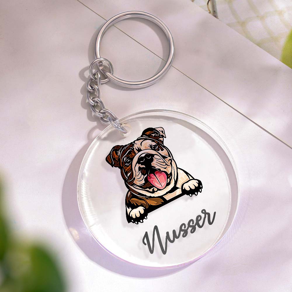Selection of personalised acrylic dog keyrings featuring different designer dog breeds and custom names perfect gifts for dog owners and dog lovers