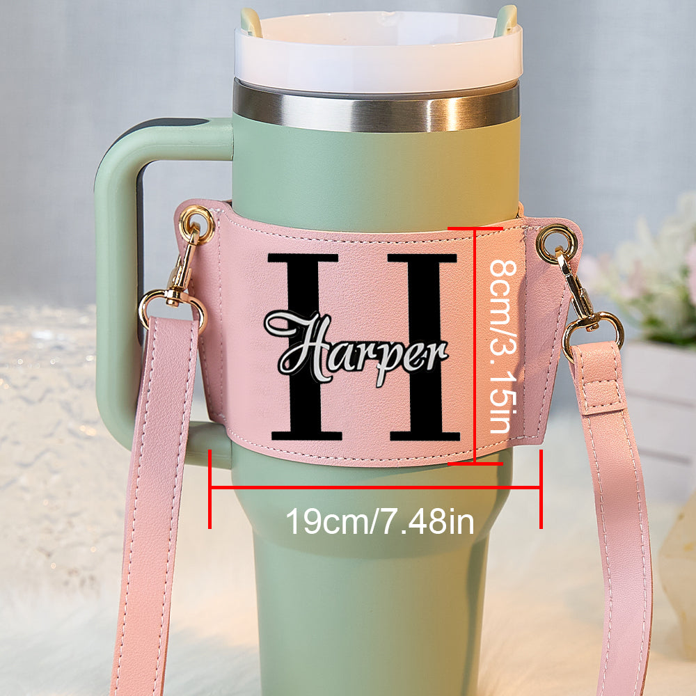 Lifestyle shot of model wearing a personalised water bottle carrier crossbody with a 40oz Stanley tumbler for travel and gym