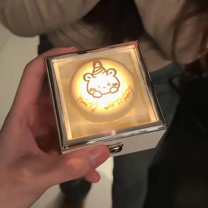 Bear Cake Ring Box in copper with flickering candlelight and rotating ring reveal — elegant surprise ring gift for her