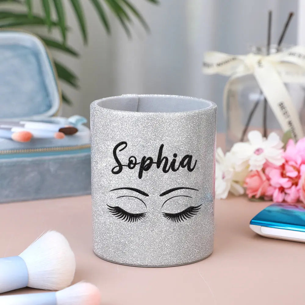 Side-angle detail of a personalised glitter leather makeup brush holder highlighting premium edges, stitching and glitter finish — a chic vanity accessory