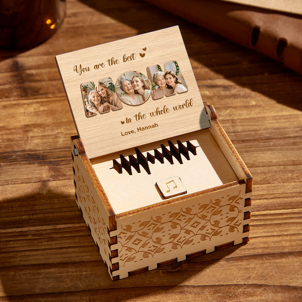 Personalised wooden music box displaying engraved custom text beneath a printed photograph — compact personalised keepsake for birthdays and family gifts
