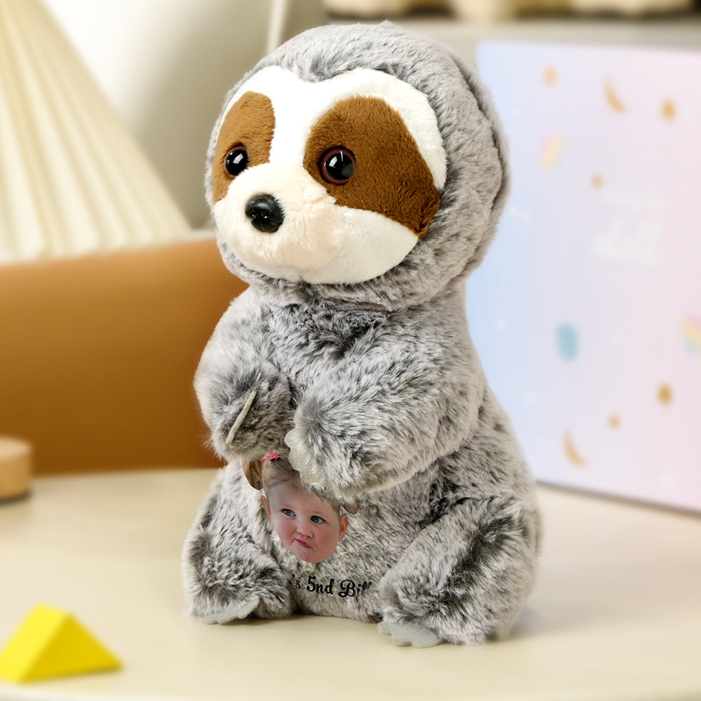 Scale shot of personalised sloth plush held in hand to show size 14cm x 25cm, soft cuddly companion for children