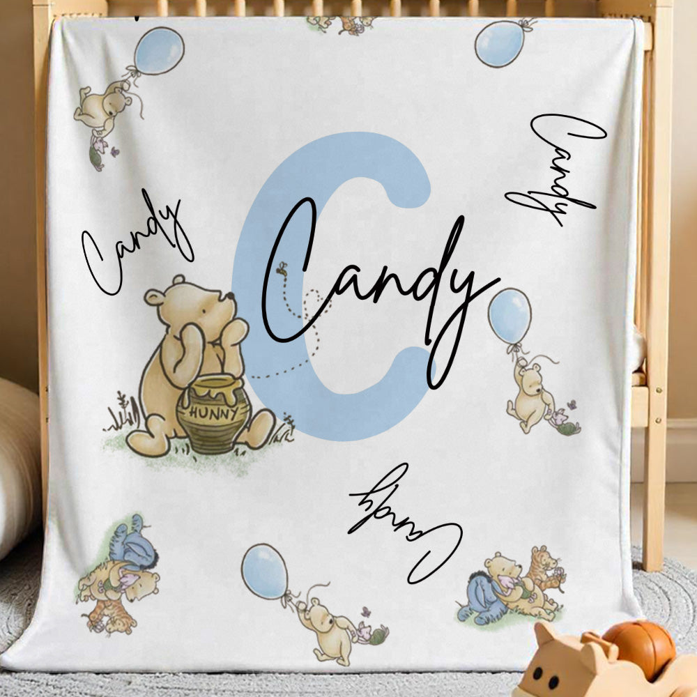 Pooh characters and personalised name area on the blanket.