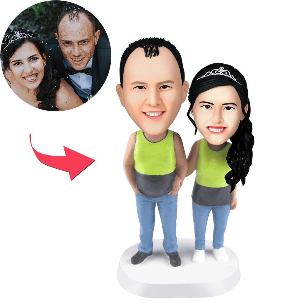 Custom couple bobblehead in matching tank tops with engraved text on base — personalised anniversary gift handcrafted from food-grade polymer clay.