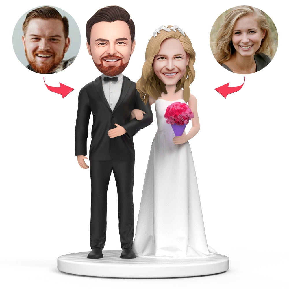 Personalised couple wedding bobblehead with bride in white dress holding bouquet, engraved base text, handmade polymer clay keepsake ideal as a personalised wedding gift in the UK and Australia