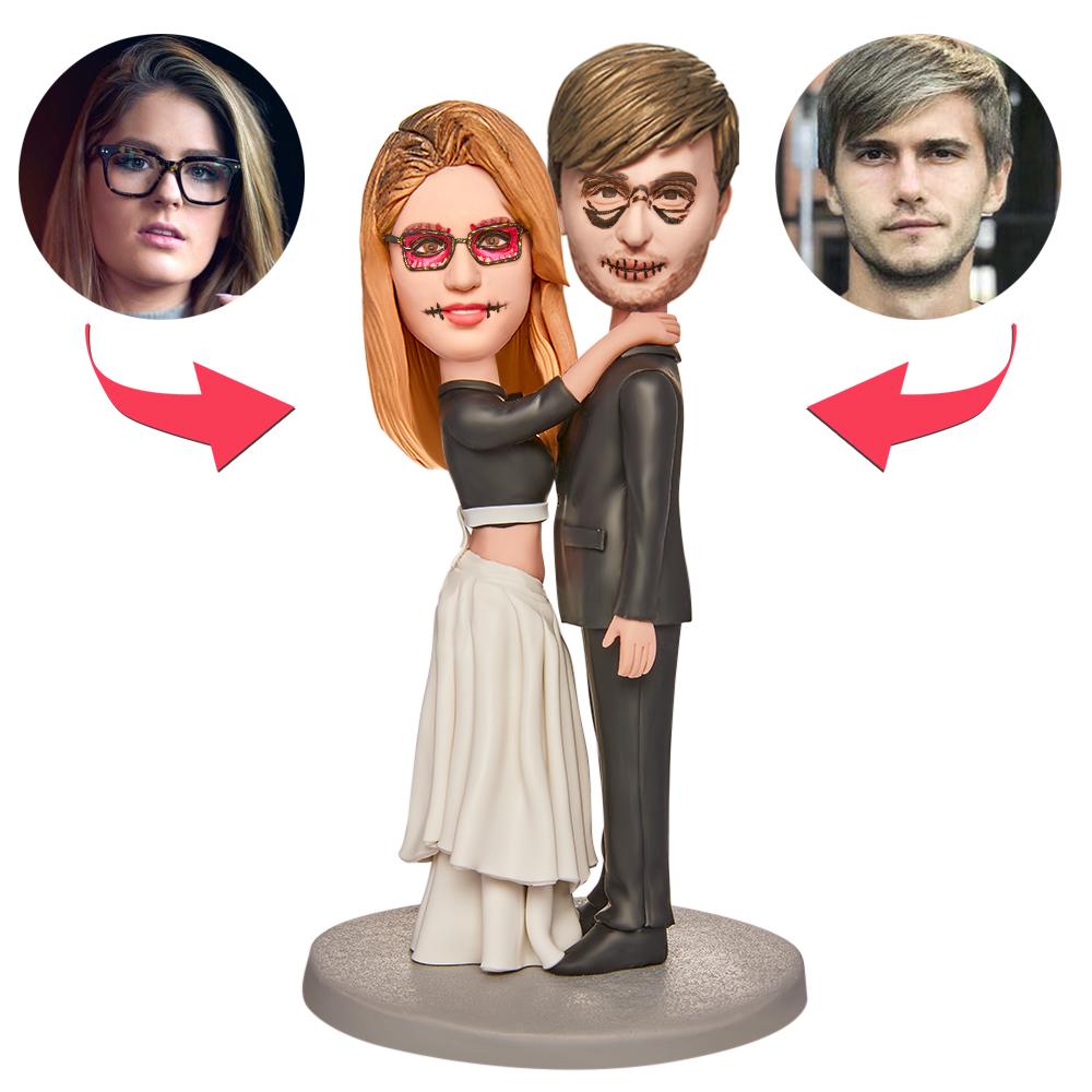 Personalised Halloween wedding bobblehead couple in polymer clay with engraved text on the base — customisable heads, expressions and hairstyles for a quirky wedding keepsake