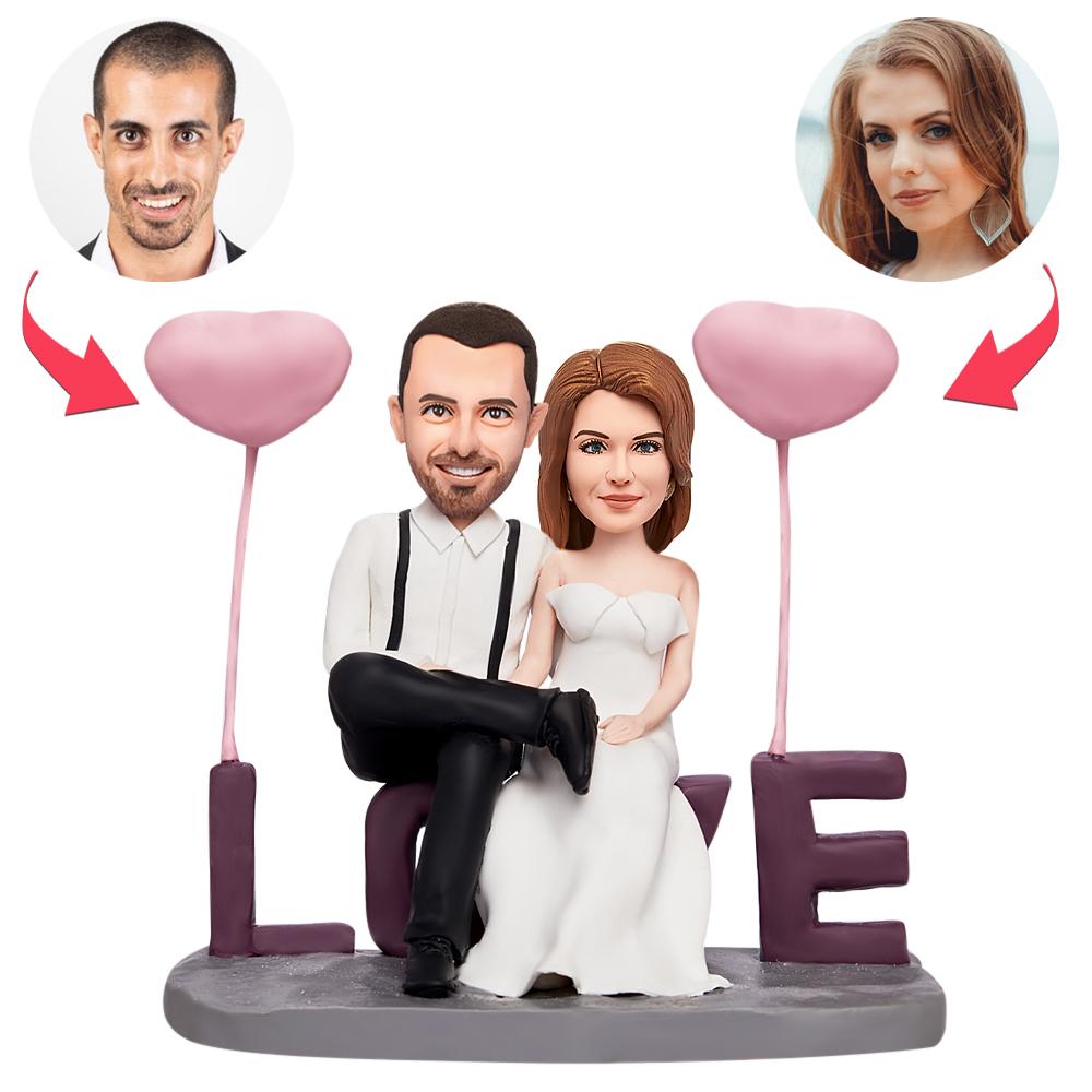 Valentine's personalised 'Sitting in LOVE' custom bobblehead couple — polymer clay figurine with engraved base text, ideal personalised gift for couples in the UK and Australia