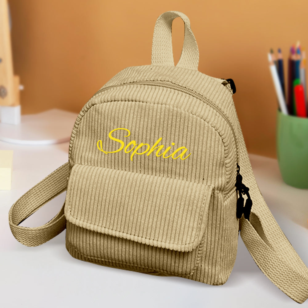 Interior view of mini corduroy backpack showing single roomy compartment – fits snacks and daily essentials for kids