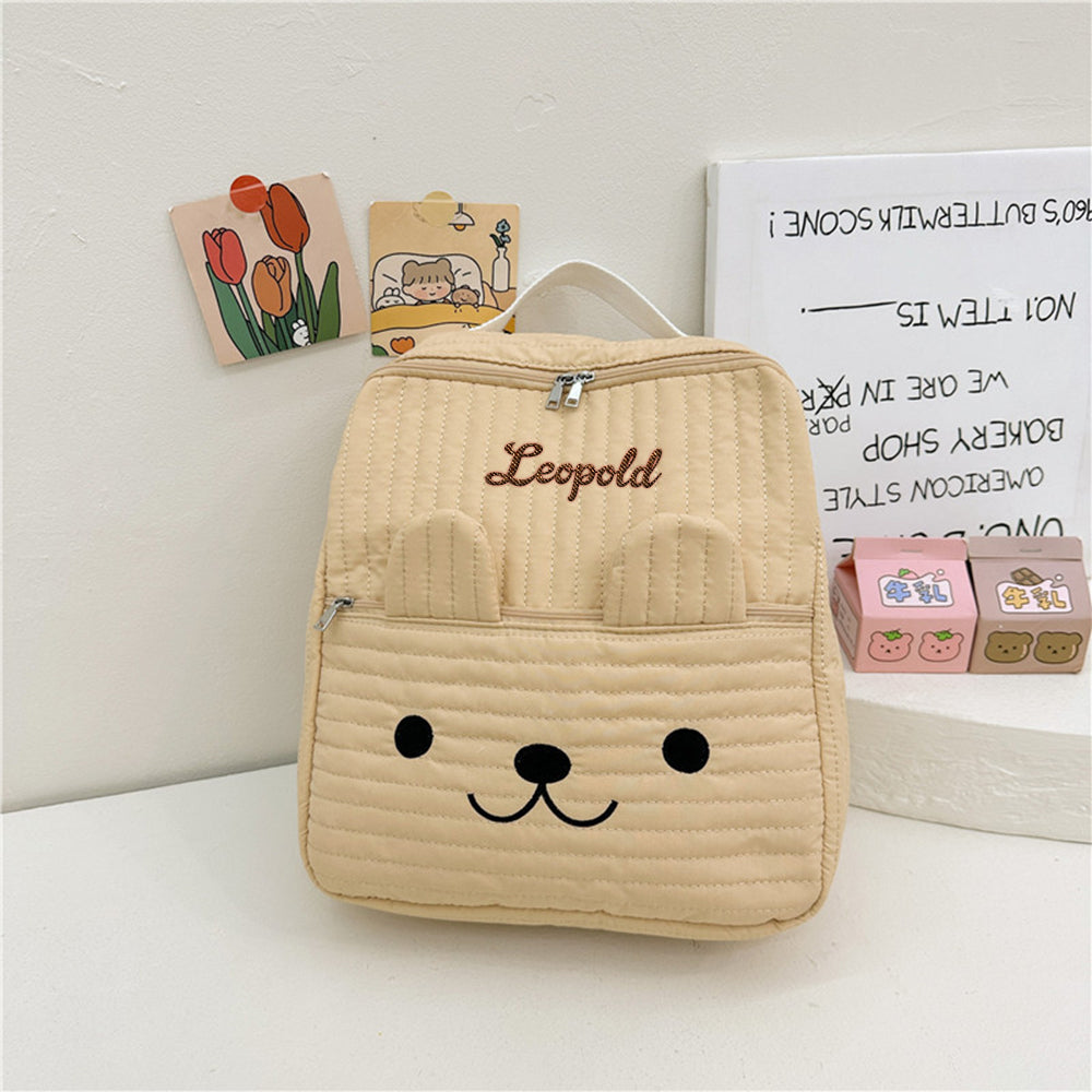Custom canvas school bag side view showing neat stitching and embroidered name on front pocket — personalised backpack for nursery and school